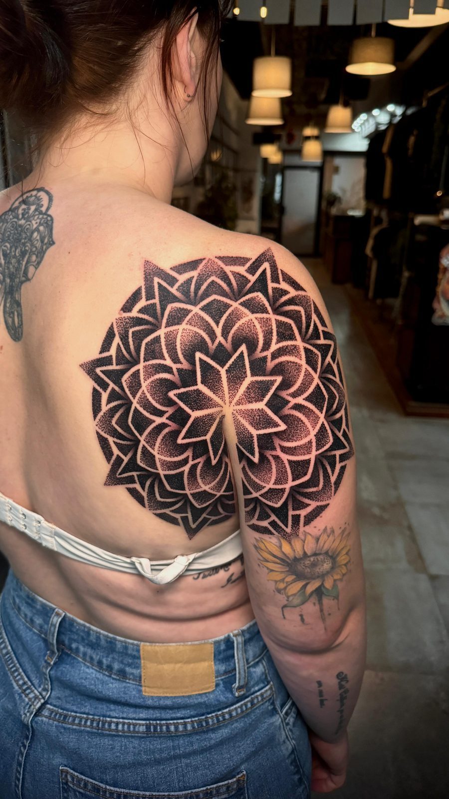 Back mandala — geometric dotwork across the shoulder
