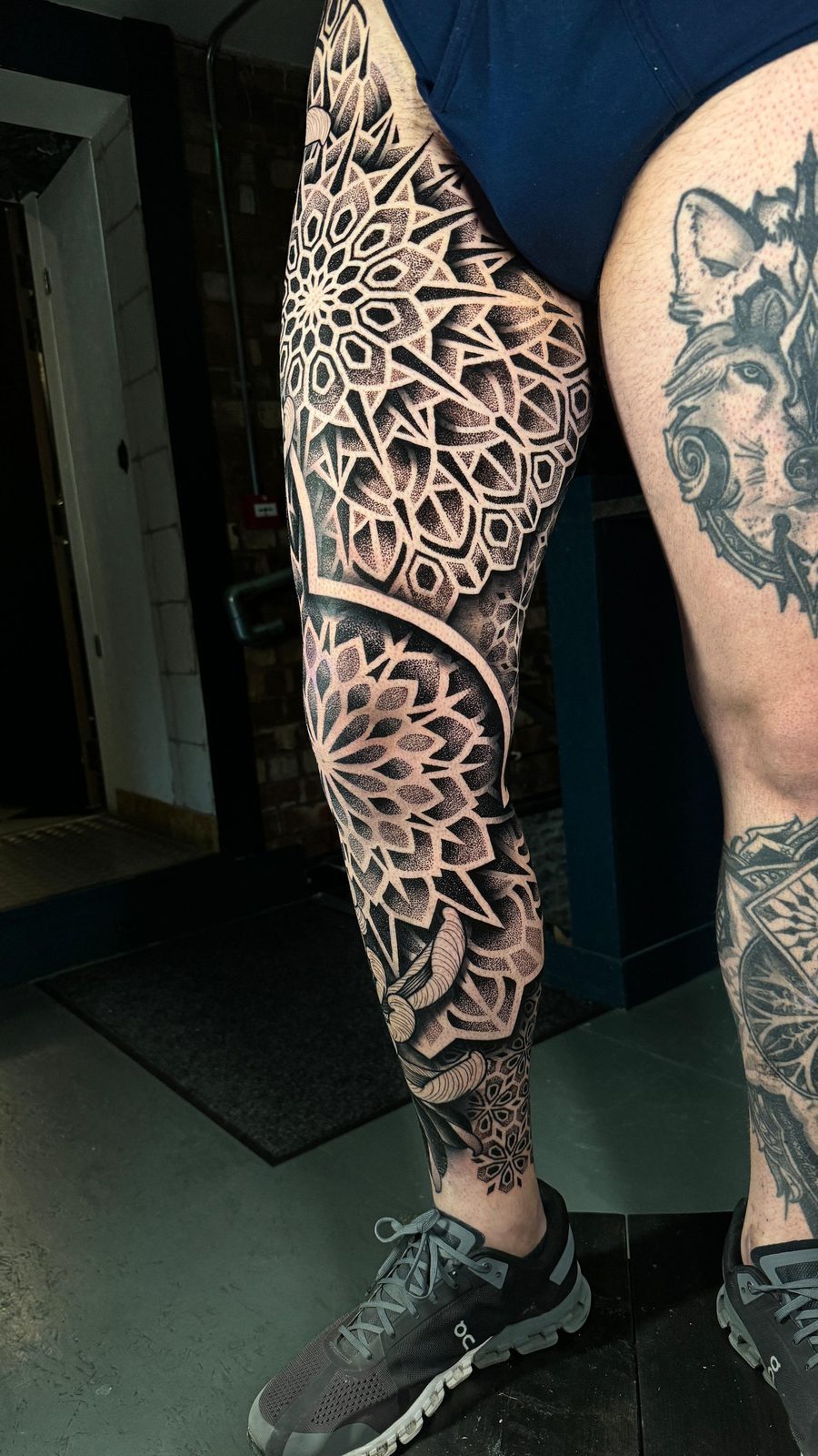 Mandala leg sleeve — geometric tattoo hip to ankle